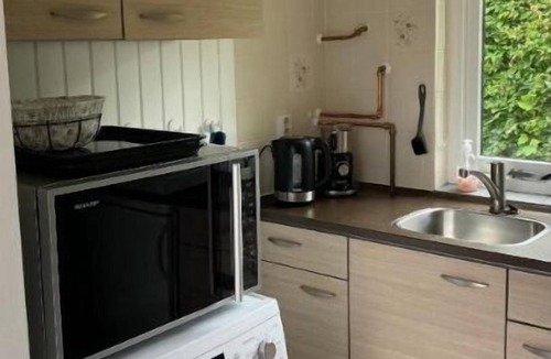 Sint Maartensvlotbrug House | 15-minute bike ride from the sea! Lovely vacation bungalow with spacious garden.