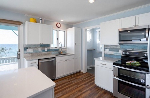 Mears House | This charming vacation home sits directly on Lake Michigan and it delivers!