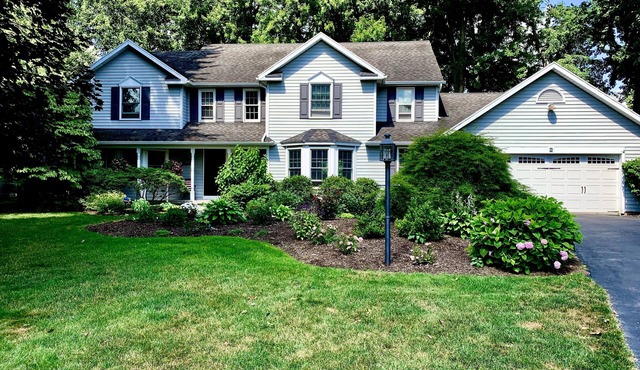 Charming, comfortable and spacious Pittsford home on a pond. in Pittsford