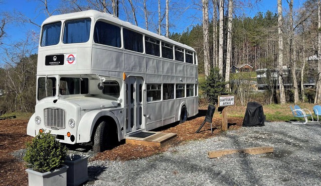 Vintage 1962 double decker bus on the creek, gas grill, fire pit, short walk to pool and playground, sleeps 4-5. in Mill Spring